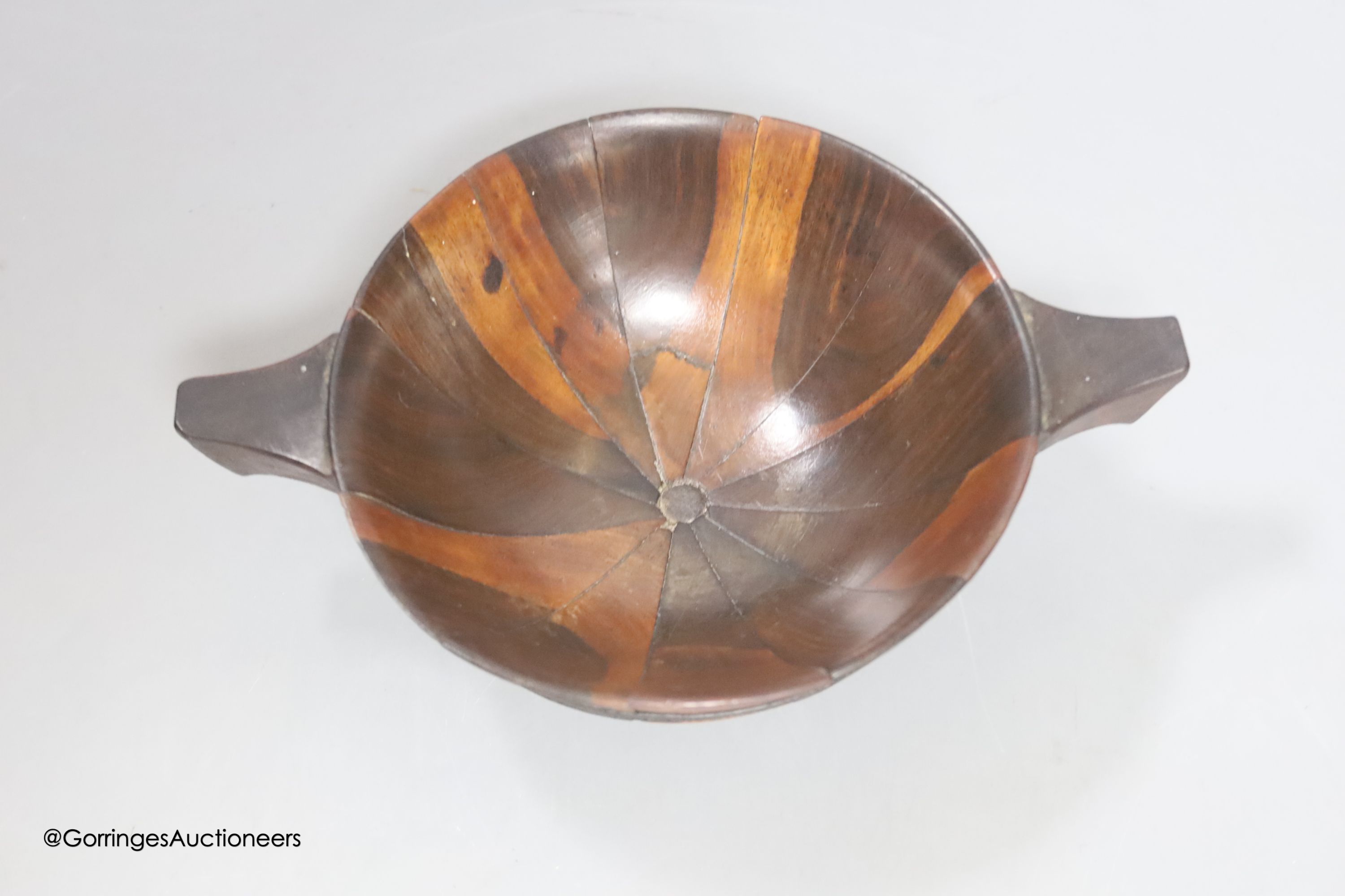 A treen quaich, Scottish, c.1900, possibly lignum vitae, length from handle to handle 16cm